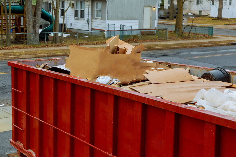 dumpster filled with trash 